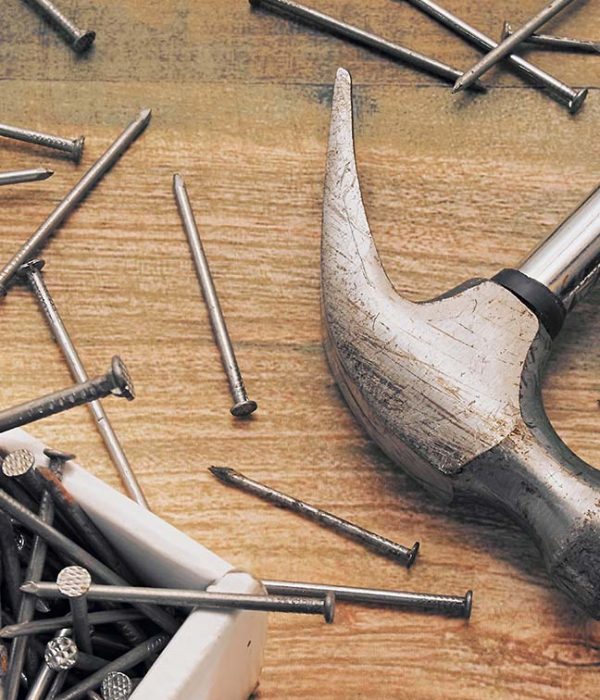 Hammer and a bunch of construction nails closeup. Repair concept.